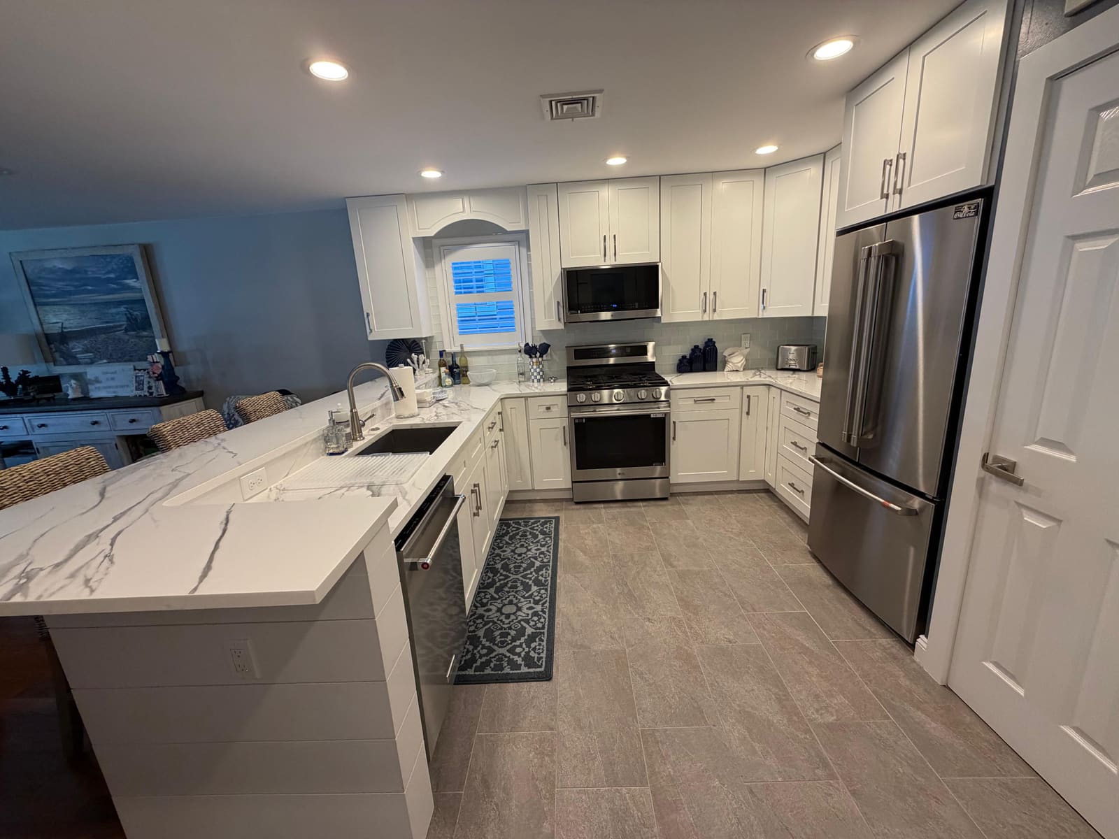 Finished Avalon, NJ kitchen remodel showing the island and dishwasher, completed by HRF Painting & Construction.