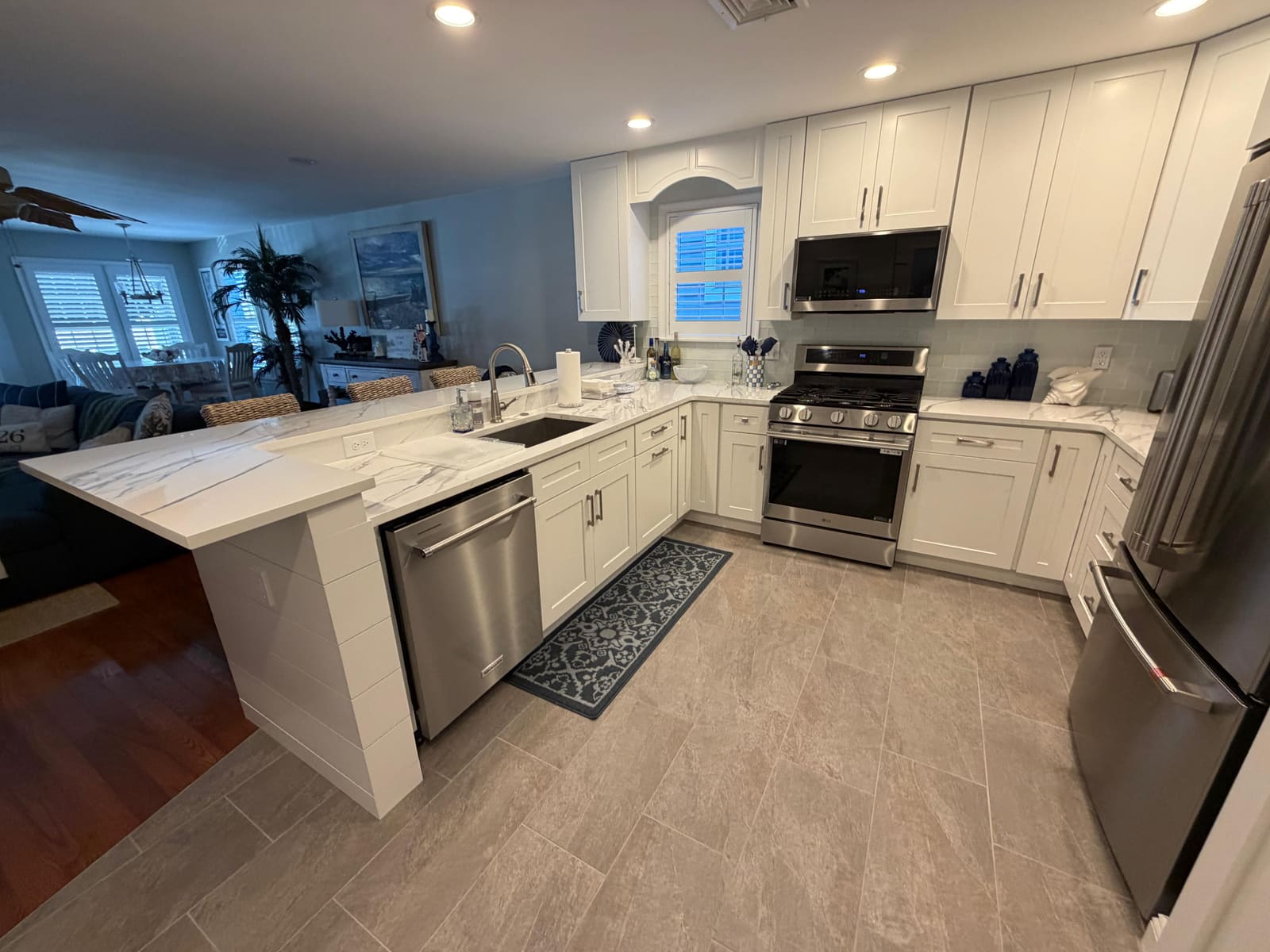 Finished Avalon, NJ kitchen remodel showing the range and cabinetry, completed by HRF Painting & Construction.