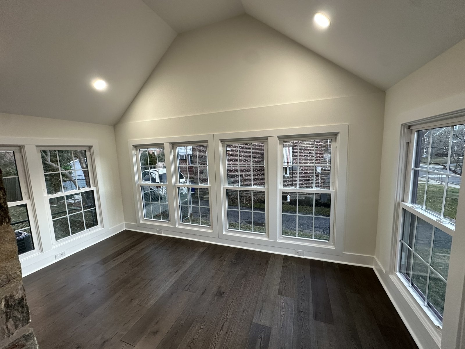 Before and after drywall, paint, and flooring renovation of a vaulted sunroom in Blackwood, NJ by HRF Painting & Construction.