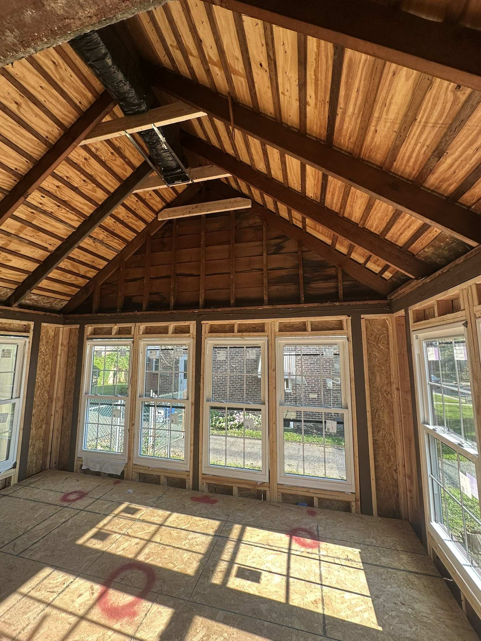 Before and after drywall, paint, and flooring renovation of a vaulted sunroom in Blackwood, NJ by HRF Painting & Construction.