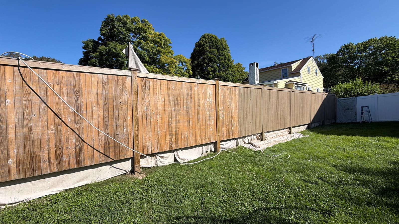 Weathered wood privacy fence before staining in Cherry Hill, NJ.