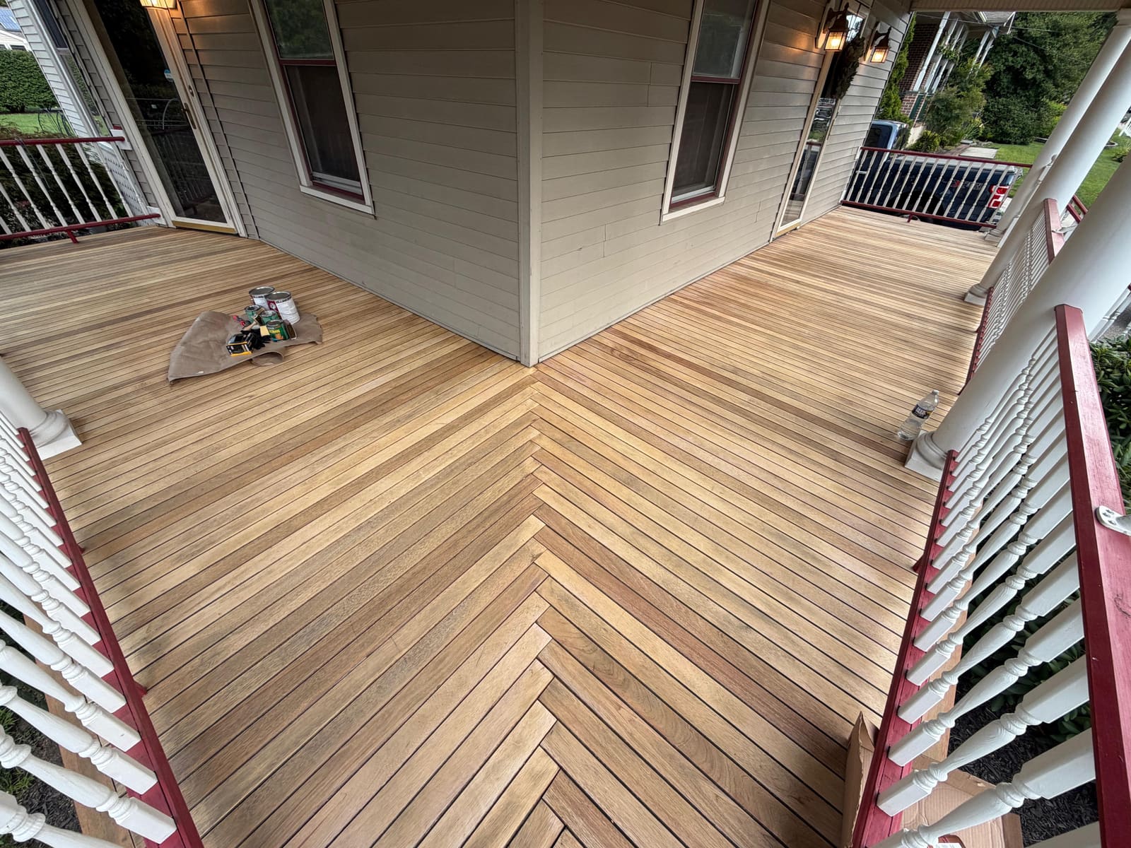 Weathered herringbone wood porch decking before restoration in Cherry Hill, NJ.
