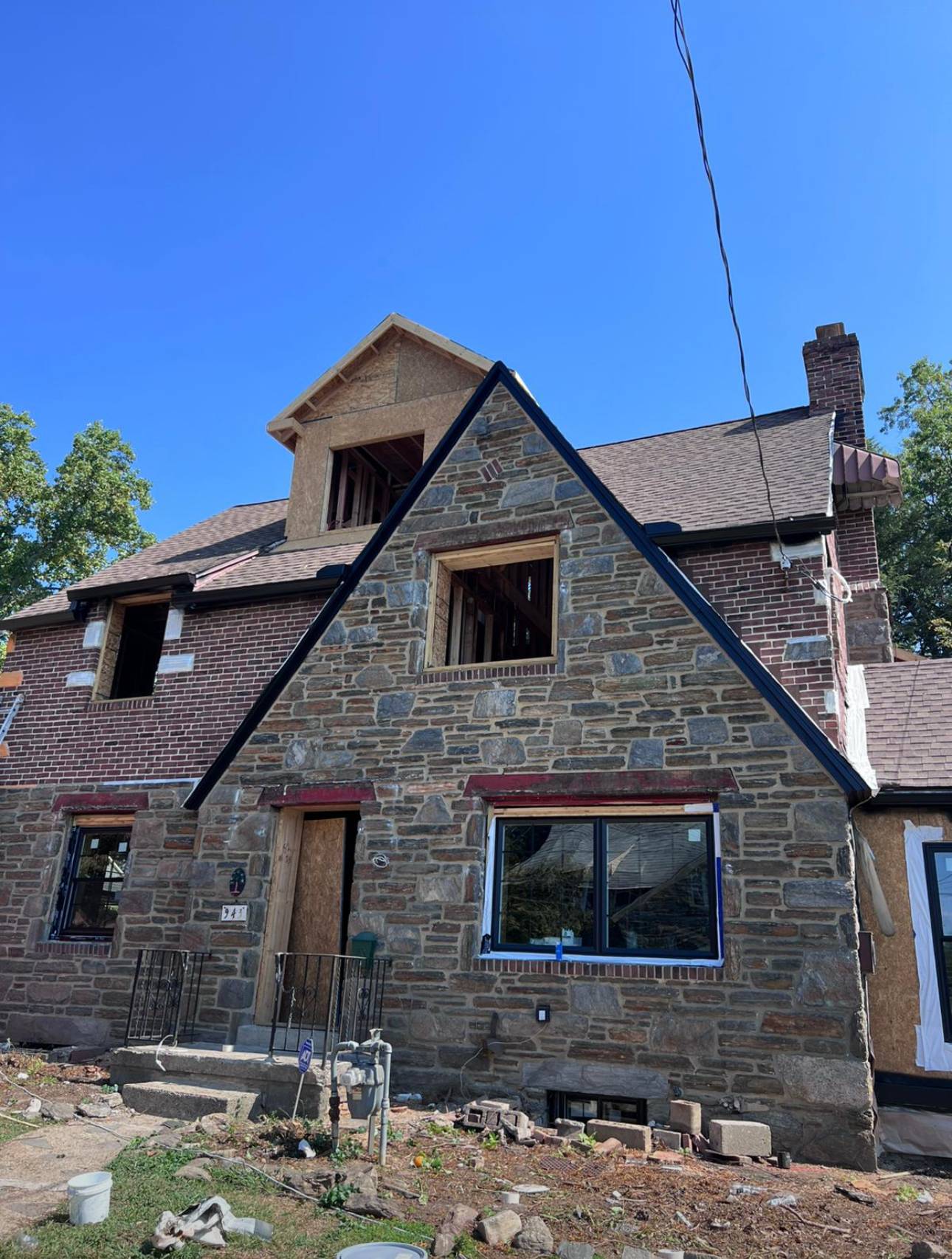 Completed stone-facade home addition by HRF Painting & Construction in New Jersey.