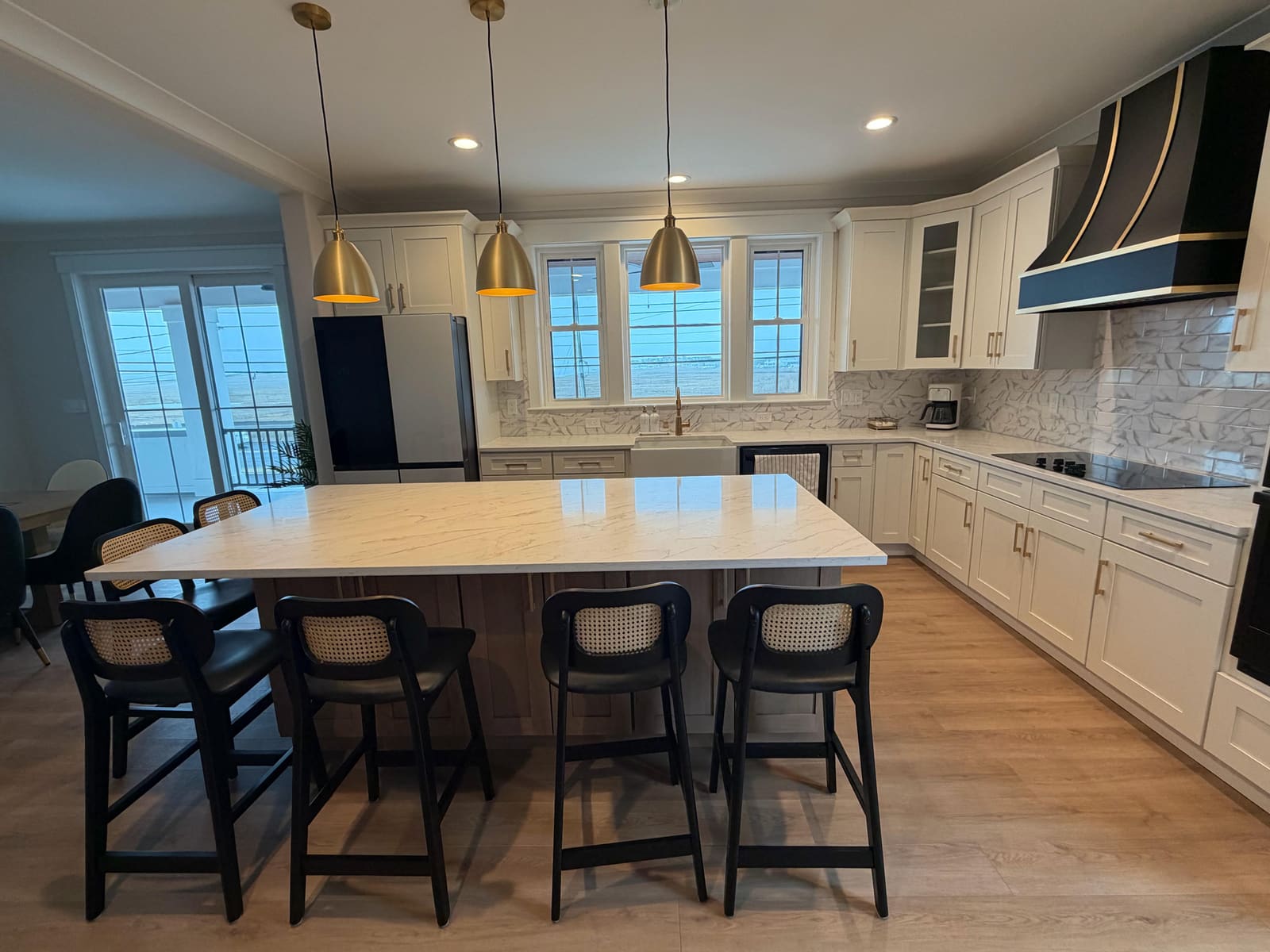 Finished Ocean City, NJ kitchen remodel showing the range hood and backsplash, completed by HRF Painting & Construction.