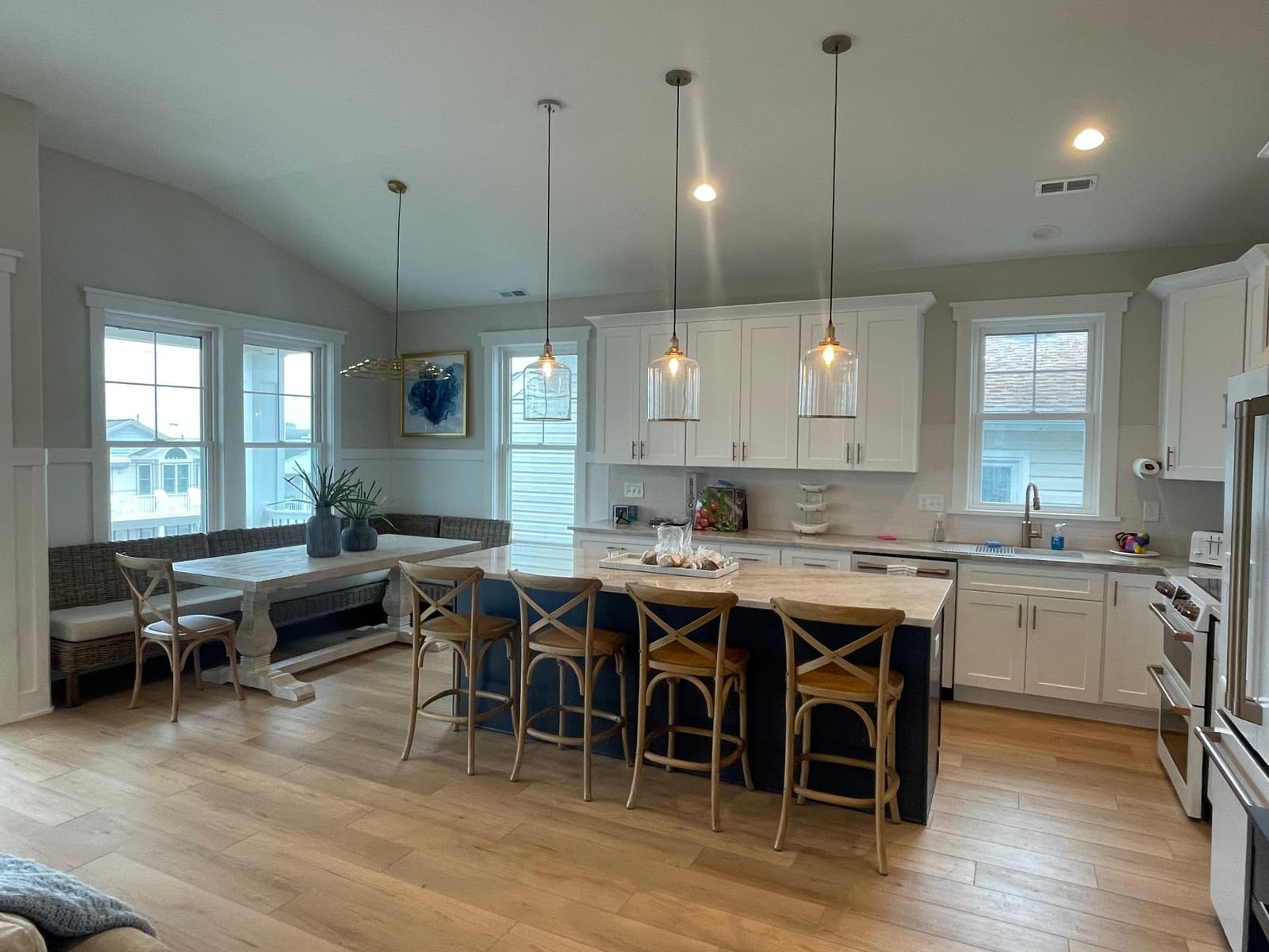 Finished Ocean City, NJ kitchen remodel showing the breakfast nook and island seating, completed by HRF Painting & Construction.